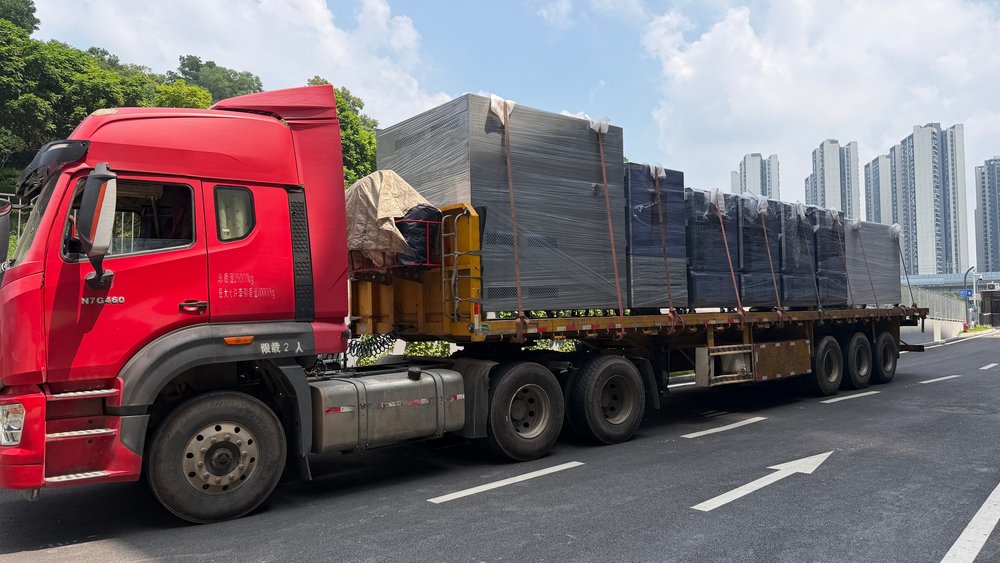 The loaded trailer carrying seven Derui environmental test chambers arriving at the customer site